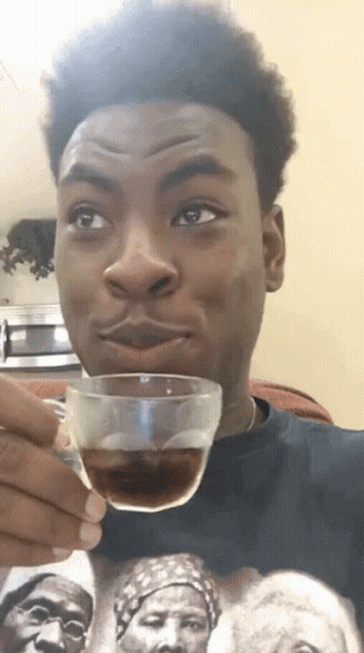 Young Man Holding Cup Of Coffee GIF