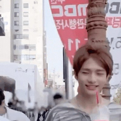 Young Man Holding Drink Smiling GIF