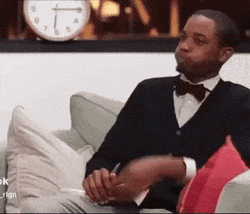 Young Man Holding In Laugh Burst Out GIF