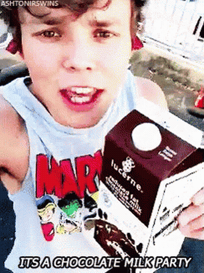 Young Man Holding Lucerne Milk GIF