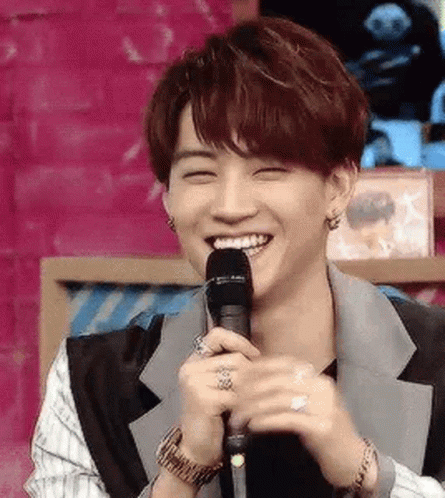 Young Man Holding Microphone Smiling GIF
