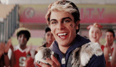 Young Man Holding Rabbit Smiling At Crowd GIF