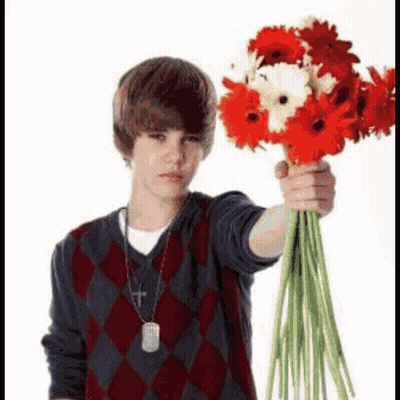Young Man Holding Red And White Flowers GIF