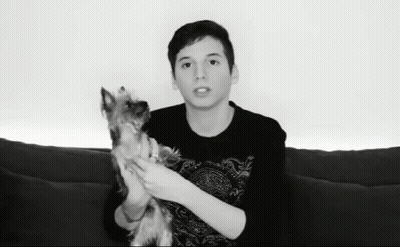 Young Man Holding Small Dog GIF