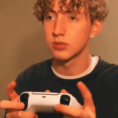 Young Man Holding Video Game Controller GIF