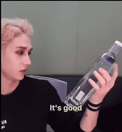 Young Man Holding Water Bottle Saying It's Good GIF