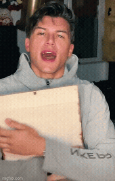 Young Man Holding Wood Making Funny Face GIF
