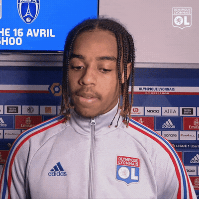 Young Man In Adidas Jacket At Olympique Lyonnais Sign GIF