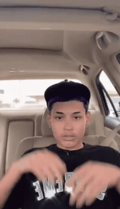 Young Man In Back Seat Wearing Fame Shirt GIF