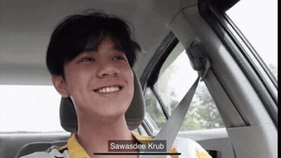 Young Man In Back Seat With Seat Belt Around Neck GIF