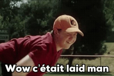 Young Man In Baseball Cap And Red Shirt Standing In Field GIF