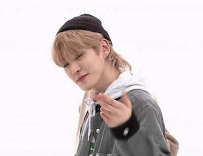 Young Man In Beanie And Green Jacket Making Funny Face GIF