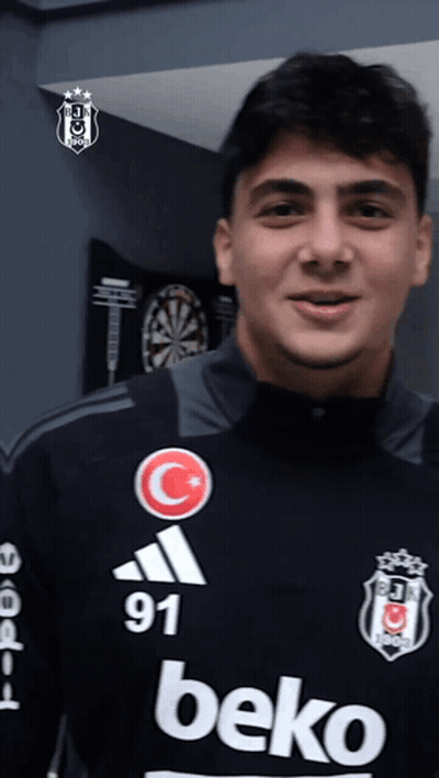 Young Man In Beko Jersey In Front Of Dartboard GIF