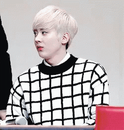 Young Man In Black And White Checkered Sweater GIF