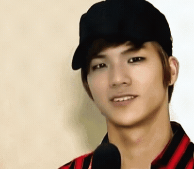 Young Man In Black Hat And Striped Shirt Smiling GIF
