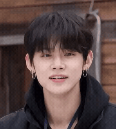 Young Man In Black Hoodie And Earrings GIF