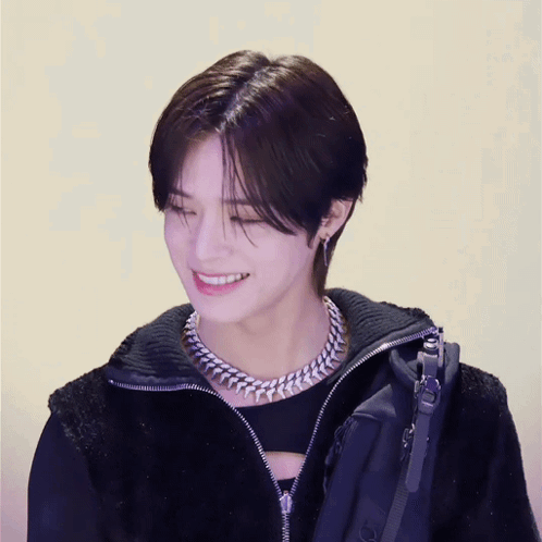 Young Man In Black Jacket And Chain Smiling GIF