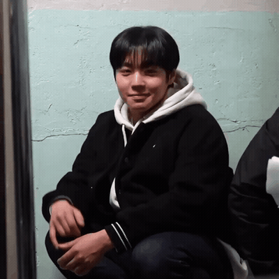 Young Man In Black Jacket And White Hoodie GIF
