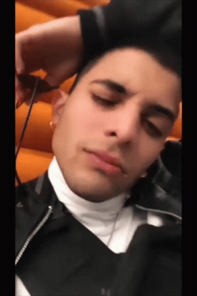 Young Man In Black Jacket Resting Head GIF