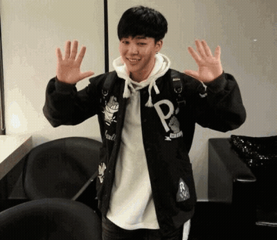 Young Man In Black Jacket With Letter P GIF