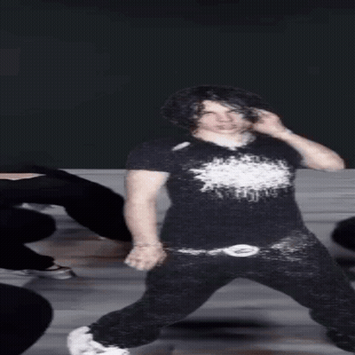 Young Man In Black Shirt And Black Pants GIF