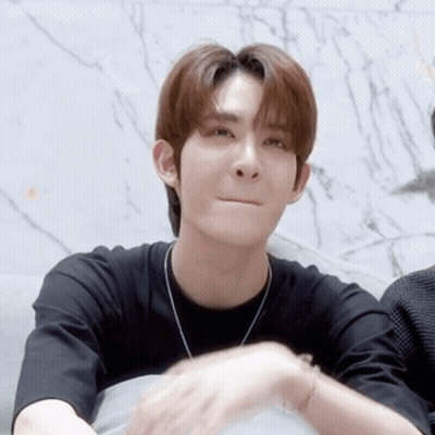 Young Man In Black Shirt And Necklace GIF