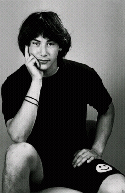 Young Man In Black Shirt And Shorts With Smiley Face GIF