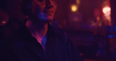 Young Man In Black Shirt And Silver Studded Belt GIF