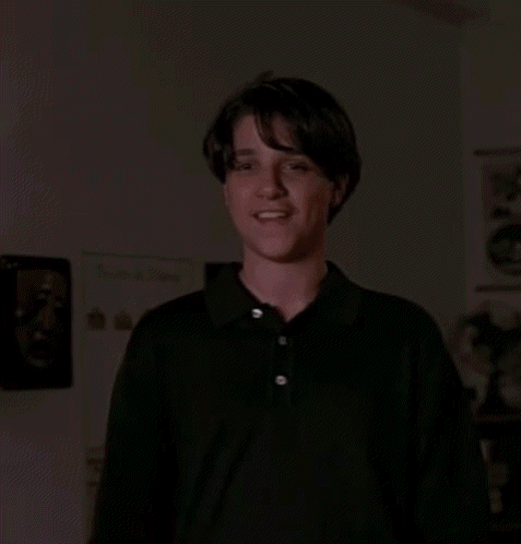 Young Man In Black Shirt Giving Thumbs Up GIF