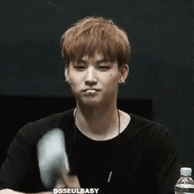 Young Man In Black Shirt Holding Cotton Candy GIF