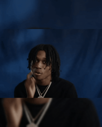 Young Man In Black Shirt Looking In Mirror GIF