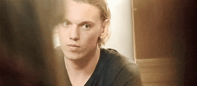 Young Man In Black Shirt Looking In Mirror GIF