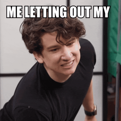 Young Man In Black Shirt Making Funny Face GIF