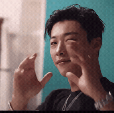 Young Man In Black Shirt Making Funny Face GIF
