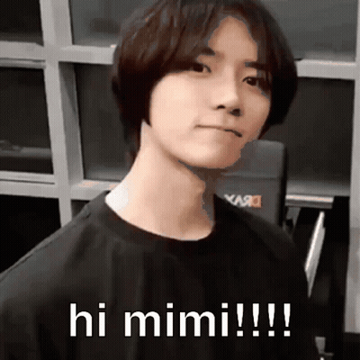 Young Man In Black Shirt Says Hi Mimi GIF