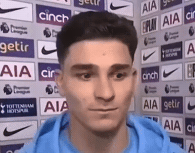 Young Man In Black Suit And Tie In Hallway GIF
