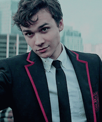 Young Man In Black Suit With Red Stripe Sleeves GIF