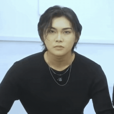 Young Man In Black Sweater And O Necklace GIF