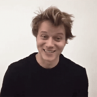 Young Man In Black Sweater Smiling GIF