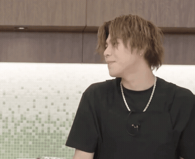 Young Man In Black T-Shirt And Silver Chain GIF