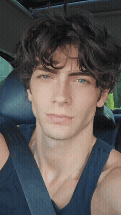 Young Man In Black Tank Top And Seat Belt GIF