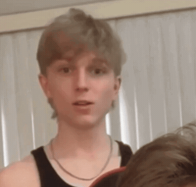 Young Man In Black Tank Top With Chain GIF