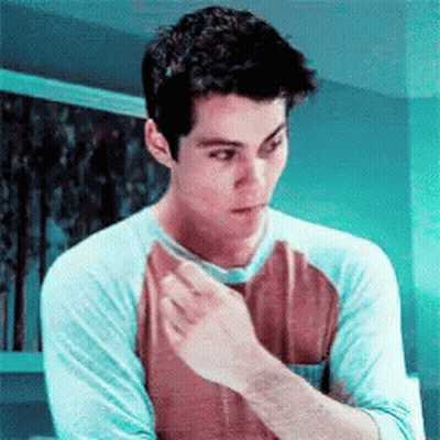 Young Man In Blue And Brown Shirt GIF