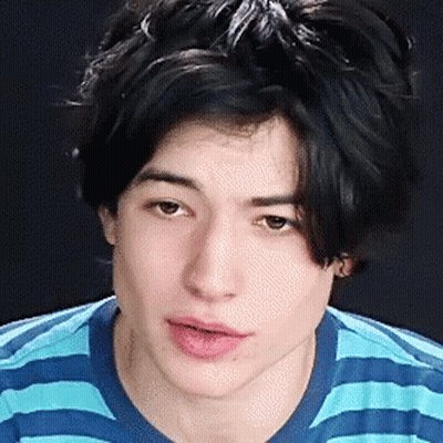 Young Man in Blue and White Striped Shirt