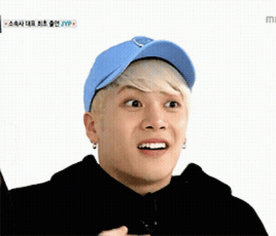 Young Man In Blue Hat And Black Hoodie GIF