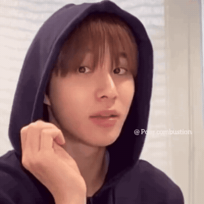 Young Man In Blue Hoodie Looking At Camera GIF