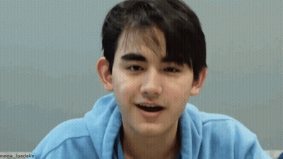 Young Man In Blue Hoodie Making Funny Face GIF