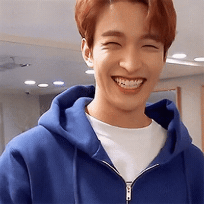 Young Man In Blue Hoodie Smiling GIF