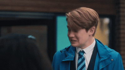 Young Man In Blue Jacket And Tie Talking GIF