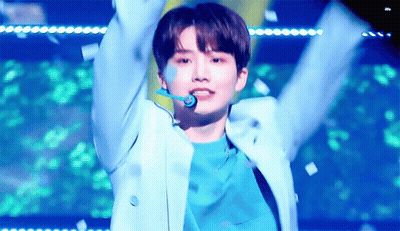 Young Man In Blue Jacket Arms Up Confetti GIF